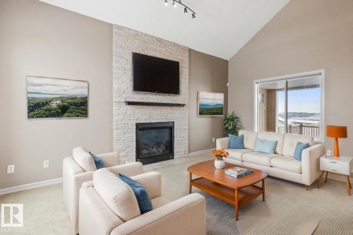 235 River Point(E), Edmonton, AB - Indoor Photo Showing Living Room With Fireplace