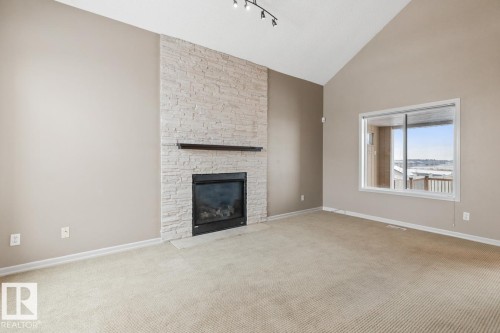 235 River Point(E), Edmonton, AB - Indoor Photo Showing Living Room With Fireplace