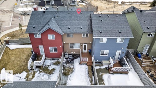 The property features a private fenced yard with a deck and direct access to the interior - 9034 Rosenthal Link Link, Edmonton, AB - Outdoor