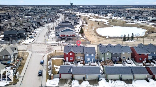Aerial view showcasing the property within a residential neighborhood featuring detached homes and townhouses - 9034 Rosenthal Link Link, Edmonton, AB - Outdoor With View