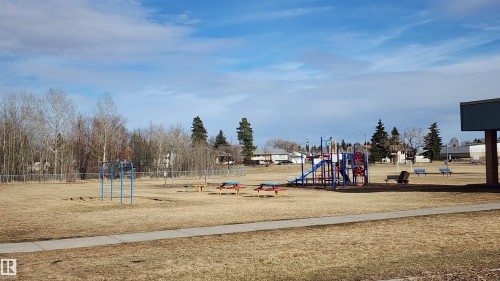 Have a family picnic in this nearby park when the sun shines! - 116 Maisonette Village, Leduc, AB - Outdoor With View