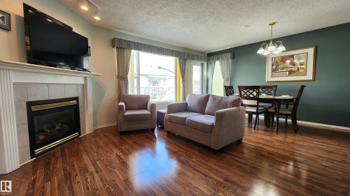 116 Maisonette Village, Leduc, AB - Indoor Photo Showing Living Room With Fireplace