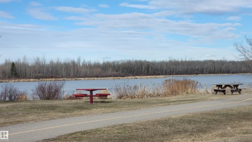 There is even a boat club here so you can indulge in water sports. - 116 Maisonette Village, Leduc, AB - Outdoor With Body Of Water With View