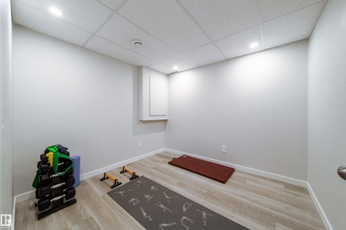 This room features light-colored walls and flooring, with recessed ceiling lights providing illumination - 22931 96 Avenue, Edmonton, AB - Indoor Photo Showing Other Room
