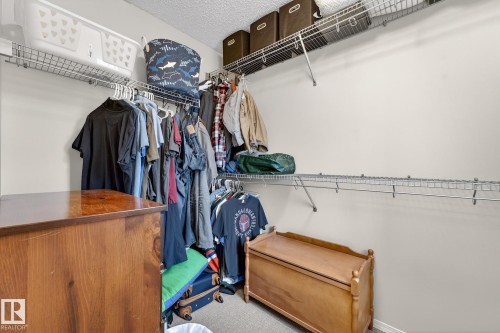 This closet features wire shelving and hanging rods for storage solutions - 219 60 Street, Edmonton, AB - Indoor With Storage