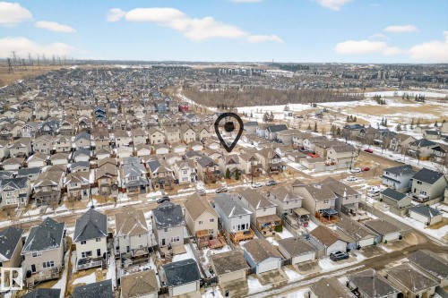 Aerial view of the surrounding neighbourhood, featuring numerous houses with various roof styles and a distant skyline - 219 60 Street, Edmonton, AB - Outdoor With View