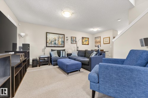 Living area featuring carpeted flooring and neutral colored walls - 219 60 Street, Edmonton, AB - Indoor Photo Showing Living Room