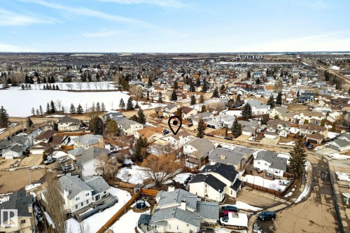 Aerial view showcasing the property within a residential community, featuring a nearby lake - 12815 156 Avenue, Edmonton, AB - Outdoor With View