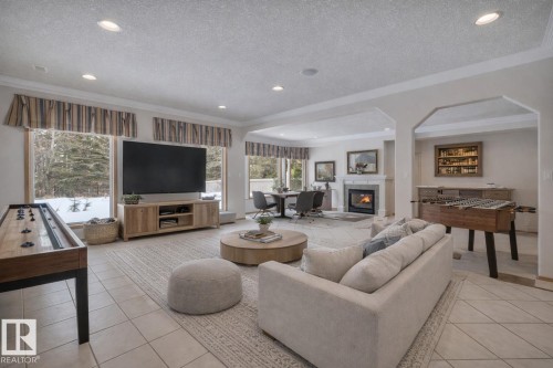 This photo has been virtually staged** - 615 Twin Brooks Bend, Edmonton, AB - Indoor Photo Showing Living Room With Fireplace