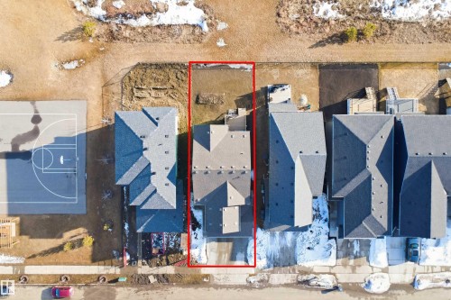 Aerial view of the property, showcasing the roofline and the perimeter of the lot - 7017 54 Avenue, Beaumont, AB - 
