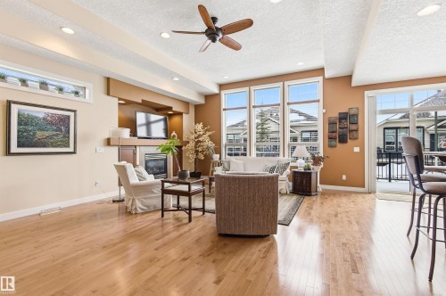 This expansive living area features hardwood floors, a ceiling fan, and recessed lighting - 13 841 156 Street, Edmonton, AB - Indoor Photo Showing Living Room