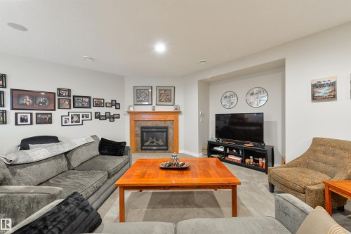 310 Caldwell Close, Edmonton, AB - Indoor Photo Showing Living Room With Fireplace