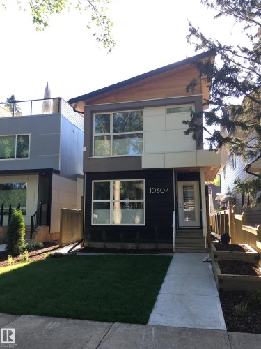 Contemporary exterior with a distinctive angled roofline and wood siding accents - 10607 127 Street, Edmonton, AB - Outdoor