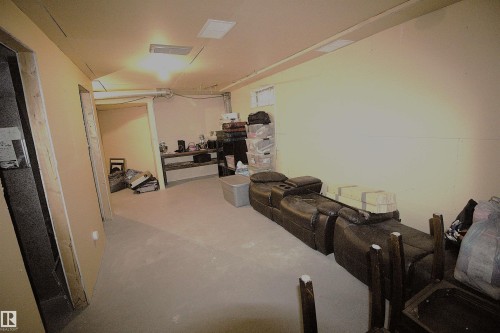 The property features an unfinished room with light-colored walls and a concrete floor - 9347 175 Avenue, Edmonton, AB - Indoor