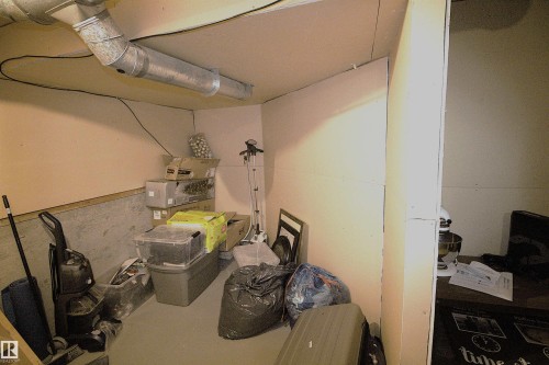 The property includes unfinished utility space featuring exposed ductwork and a partial wall - 9347 175 Avenue, Edmonton, AB - Indoor Photo Showing Basement
