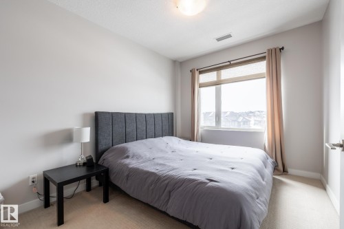 325 5151 Windermere Boulevard, Edmonton, AB - Indoor Photo Showing Bedroom