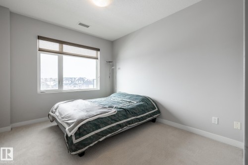 325 5151 Windermere Boulevard, Edmonton, AB - Indoor Photo Showing Bedroom