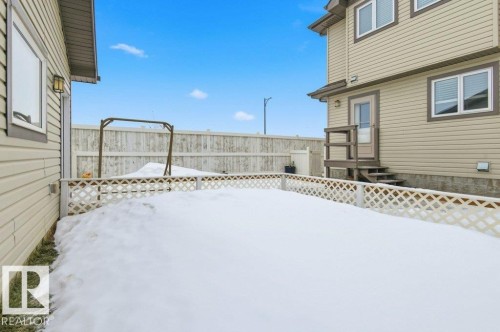 The property features a fenced yard with a gate, a deck with stairs, and exterior siding - 2 Wingate Way, Fort Saskatchewan, AB - Outdoor With Exterior