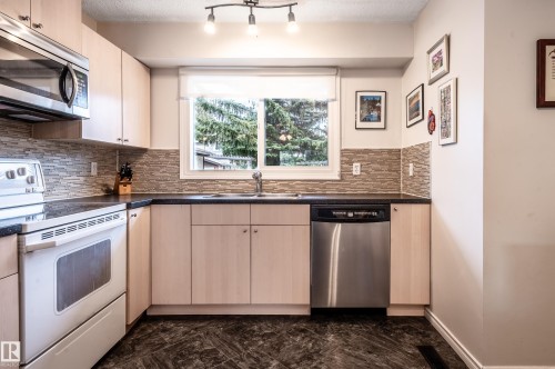 71 Forest Grove, St. Albert, AB - Indoor Photo Showing Kitchen With Double Sink