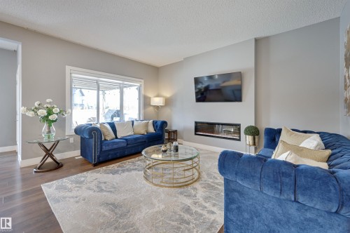 3625 Keswick Boulevard, Edmonton, AB - Indoor Photo Showing Living Room With Fireplace