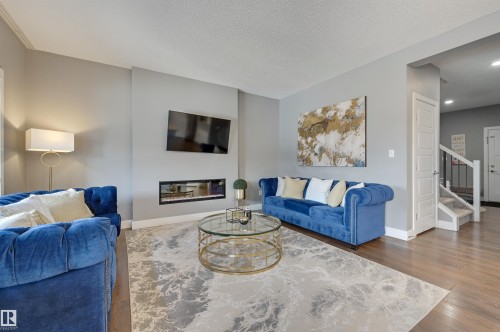 3625 Keswick Boulevard, Edmonton, AB - Indoor Photo Showing Living Room With Fireplace