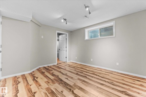 Room with light grey walls, light wood flooring, and a white trim - 84 Calvert Wynd, Fort Saskatchewan, AB - Indoor Photo Showing Other Room