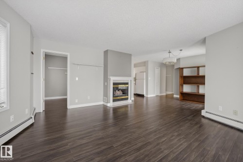 301 9138 83 Avenue, Edmonton, AB - Indoor Photo Showing Living Room With Fireplace