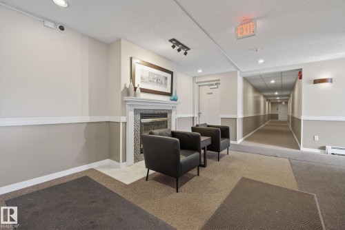 301 9138 83 Avenue, Edmonton, AB - Indoor Photo Showing Other Room With Fireplace