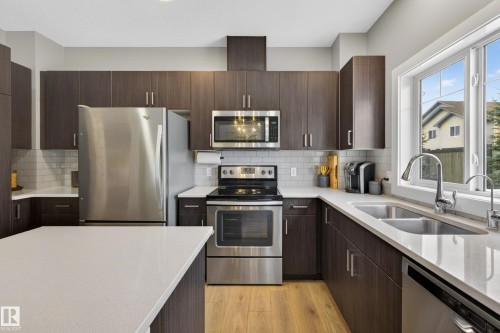 3 4835 Wright Drive, Edmonton, AB - Indoor Photo Showing Kitchen With Stainless Steel Kitchen With Double Sink With Upgraded Kitchen