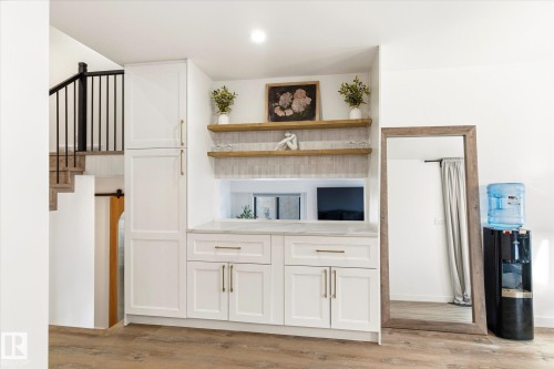 Built-in cabinetry with a light-colored countertop and shelving provides functional storage - 38 Woodcrest Avenue, St. Albert, AB - Indoor Photo Showing Other Room
