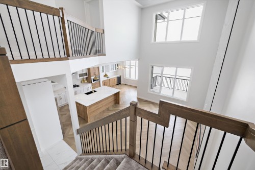 Spacious interior with high ceilings and large windows, offering ample natural light - 236 Kinglet Boulevard Nw, Edmonton, AB - Indoor Photo Showing Other Room