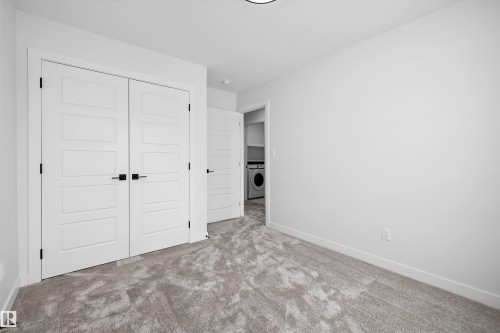 This room features light grey carpeting, white walls, and white trim - 236 Kinglet Boulevard Nw, Edmonton, AB - Indoor Photo Showing Other Room