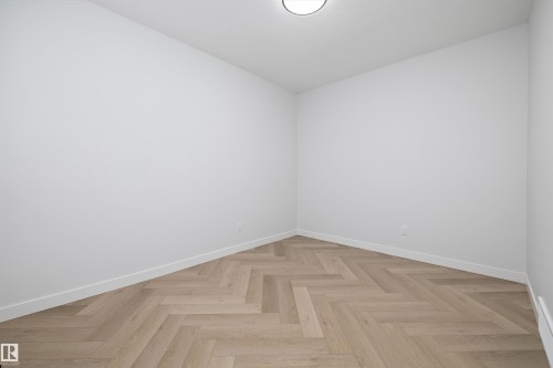 This room features light-colored walls and a ceiling light fixture - 236 Kinglet Boulevard Nw, Edmonton, AB - Indoor Photo Showing Other Room