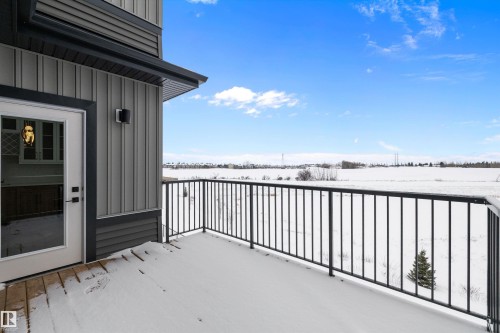 Outdoor balcony with a black metal railing and exterior siding - 236 Kinglet Boulevard Nw, Edmonton, AB - Outdoor With Exterior