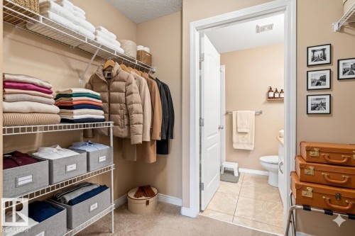 The property features a spacious closet with wire shelving and hanging space, offering extensive organization options - 224 3425 19 Street Nw, Edmonton, AB - Indoor