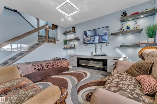 2011 18 Avenue, Edmonton, AB - Indoor Photo Showing Living Room With Fireplace