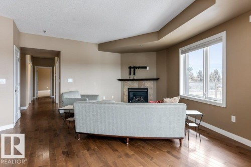 205 35 Sturgeon Road, St. Albert, AB - Indoor Photo Showing Living Room With Fireplace