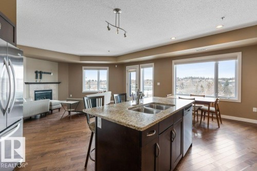 205 35 Sturgeon Road, St. Albert, AB - Indoor Photo Showing Kitchen With Fireplace With Double Sink