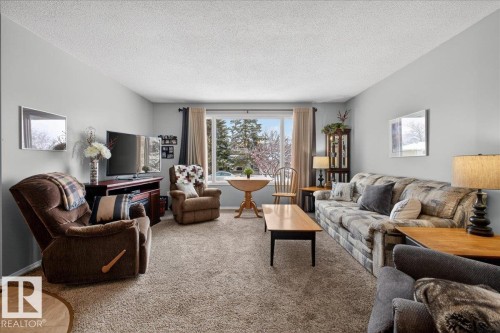 8711 22 Avenue, Edmonton, AB - Indoor Photo Showing Living Room