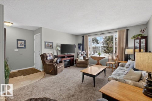 8711 22 Avenue, Edmonton, AB - Indoor Photo Showing Living Room