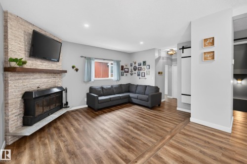 6118 37A Avenue, Edmonton, AB - Indoor Photo Showing Living Room With Fireplace