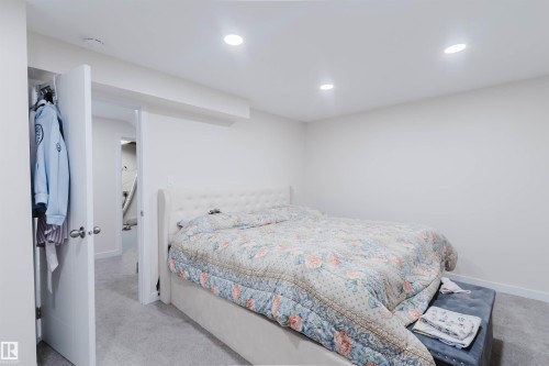 The property features a room with light-colored carpeting and recessed lighting - 18088 93 Avenue Nw, Edmonton, AB - Indoor Photo Showing Bedroom