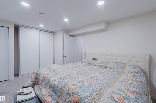 This room features recessed lighting, white walls, and a light-colored carpet - 18088 93 Avenue Nw, Edmonton, AB - Indoor Photo Showing Bedroom