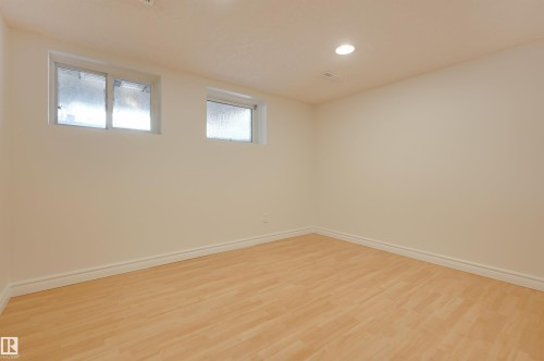 Room featuring light-toned flooring, two windows, and a recessed ceiling light - 10940 71 Avenue, Edmonton, AB - Indoor Photo Showing Other Room