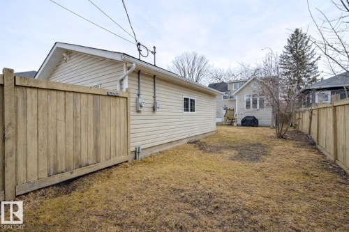 The property features a fenced yard with a detached structure - 10940 71 Avenue, Edmonton, AB - Outdoor With Exterior