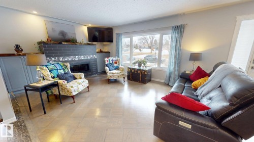 10655 52 Street, Edmonton, AB - Indoor Photo Showing Living Room With Fireplace