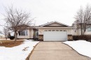 The property features a concrete driveway leading to a two-car garage - 4403 Yeoman Drive, Onoway, AB  - Outdoor With Facade 