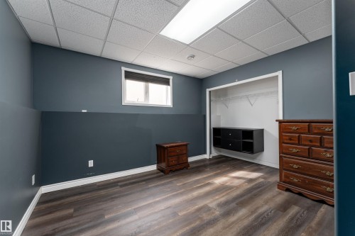 This room features resilient flooring, a window providing natural light, and a closet with shelving - 4403 Yeoman Drive, Onoway, AB - Indoor Photo Showing Other Room