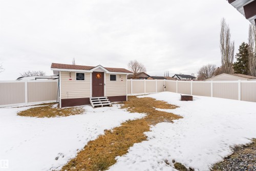 The property includes a shed with exterior siding, a private fenced yard, and a fire pit - 4403 Yeoman Drive, Onoway, AB - Outdoor