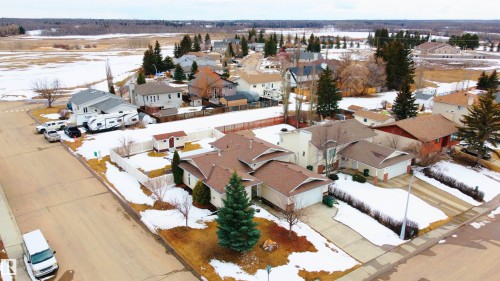 The property features a private driveway and an attached garage - 4403 Yeoman Drive, Onoway, AB - Outdoor With View